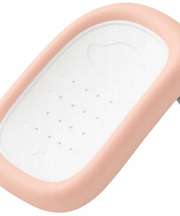 Pink-edged white plastic wall-mounted tray with a curved oval white surface and a textured pattern on the base, likely a baby product accessory.